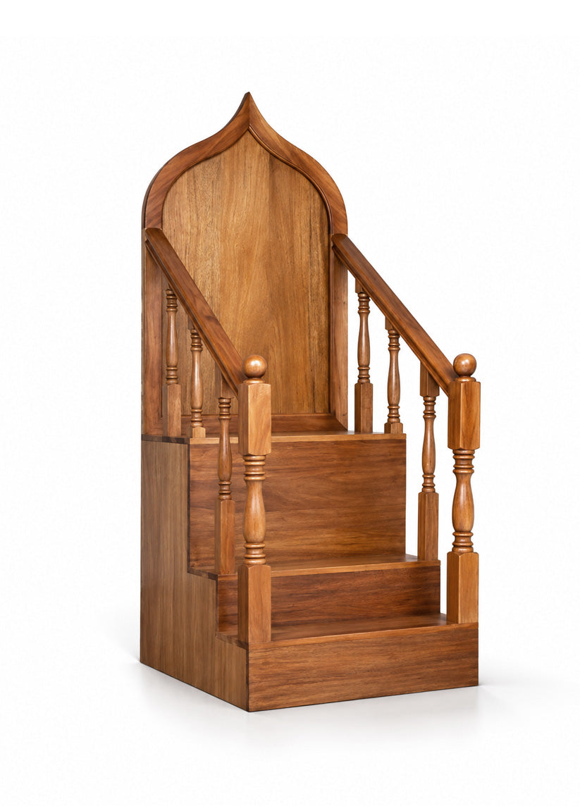 A wooden mimbar with an arched backrest, turned spindle balusters, and a warm medium-brown finish, isolated on a white background.