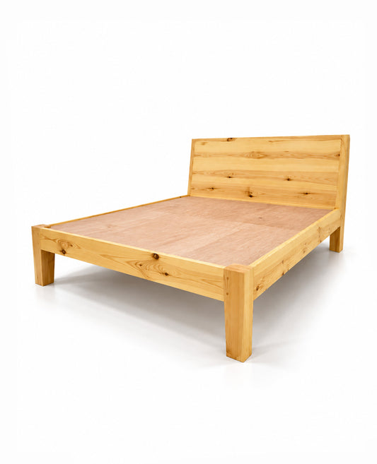 A light natural wood platform bed frame with a matching wooden headboard, shown from a three-quarters angle on a white background.