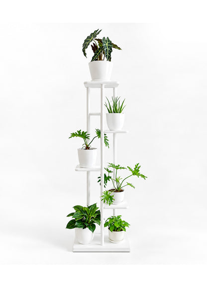 A tall white multi-tier plant stand holding several potted green houseplants, photographed against a clean white studio background.