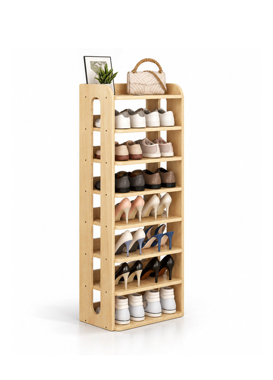 A tall, light wood multi-tier shoe rack filled with various shoes, styled with a small potted plant and a woven handbag on top, set against a plain white background.