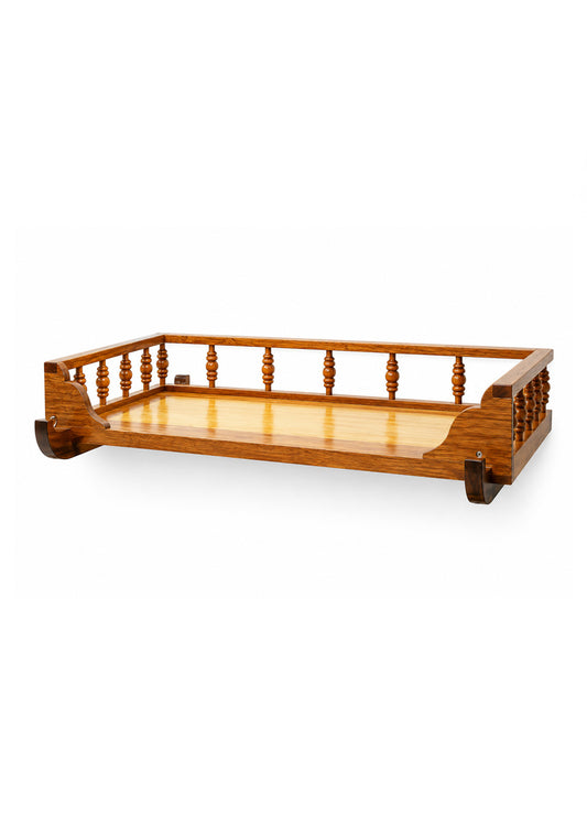 A wooden baby crib bumper or guard rail with a turned spindle design on the top and dark brown end caps, shown on a plain white background.
